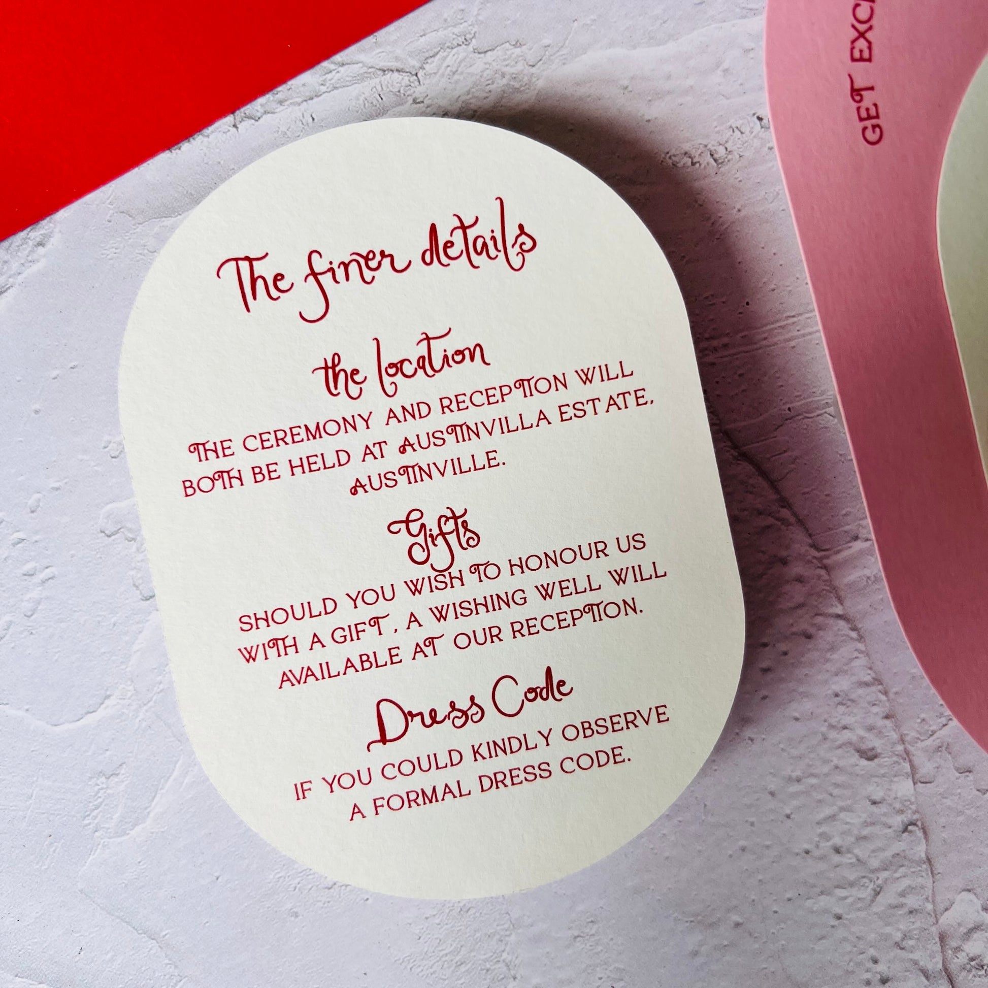 Round card with red text on a textured surface