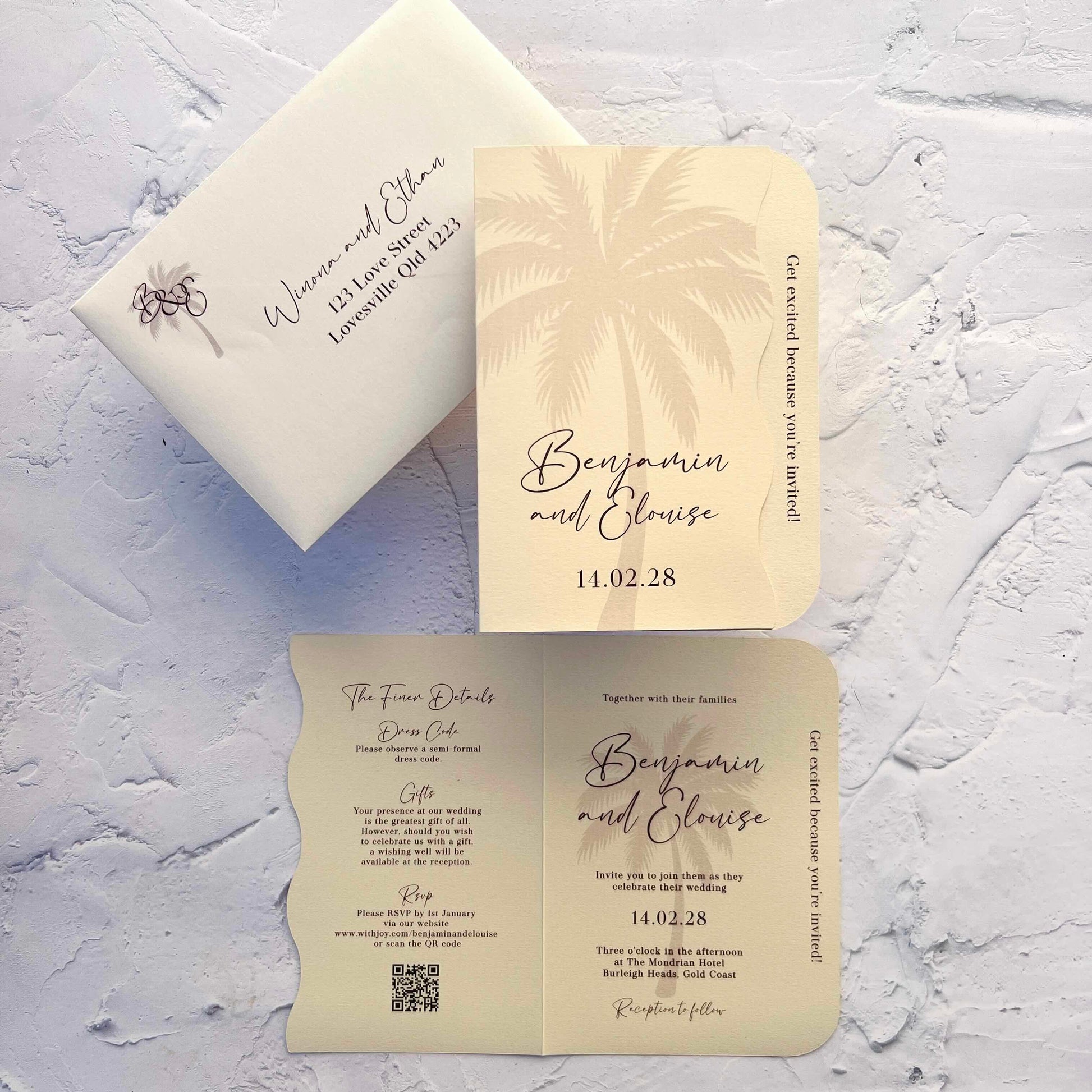 Wedding invitation set with envelope and card on a textured surface