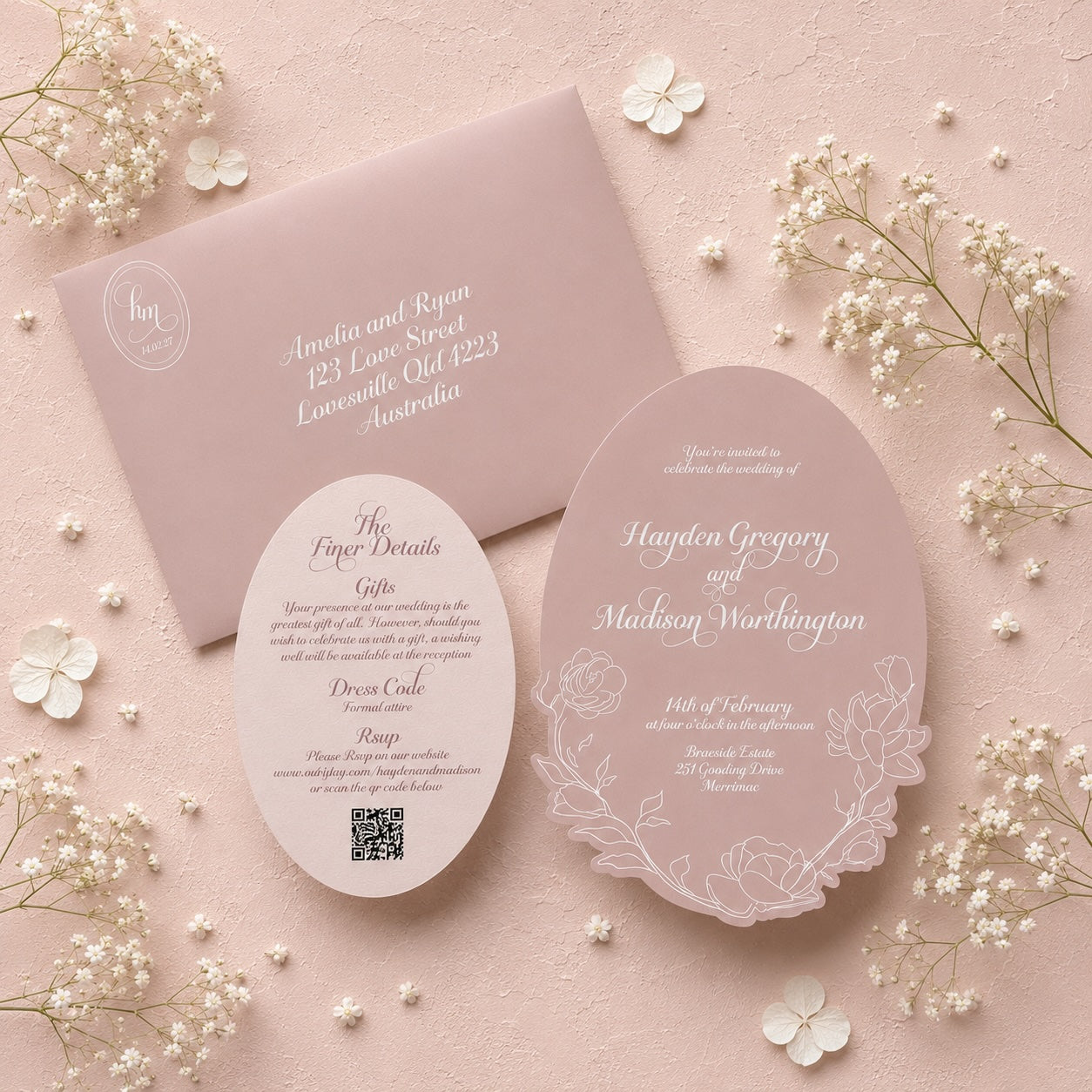 Elegant wedding invitation set with floral design on a pink background