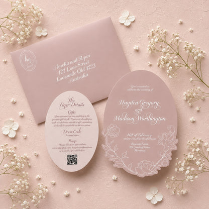 Elegant wedding invitation set with floral design on a pink background