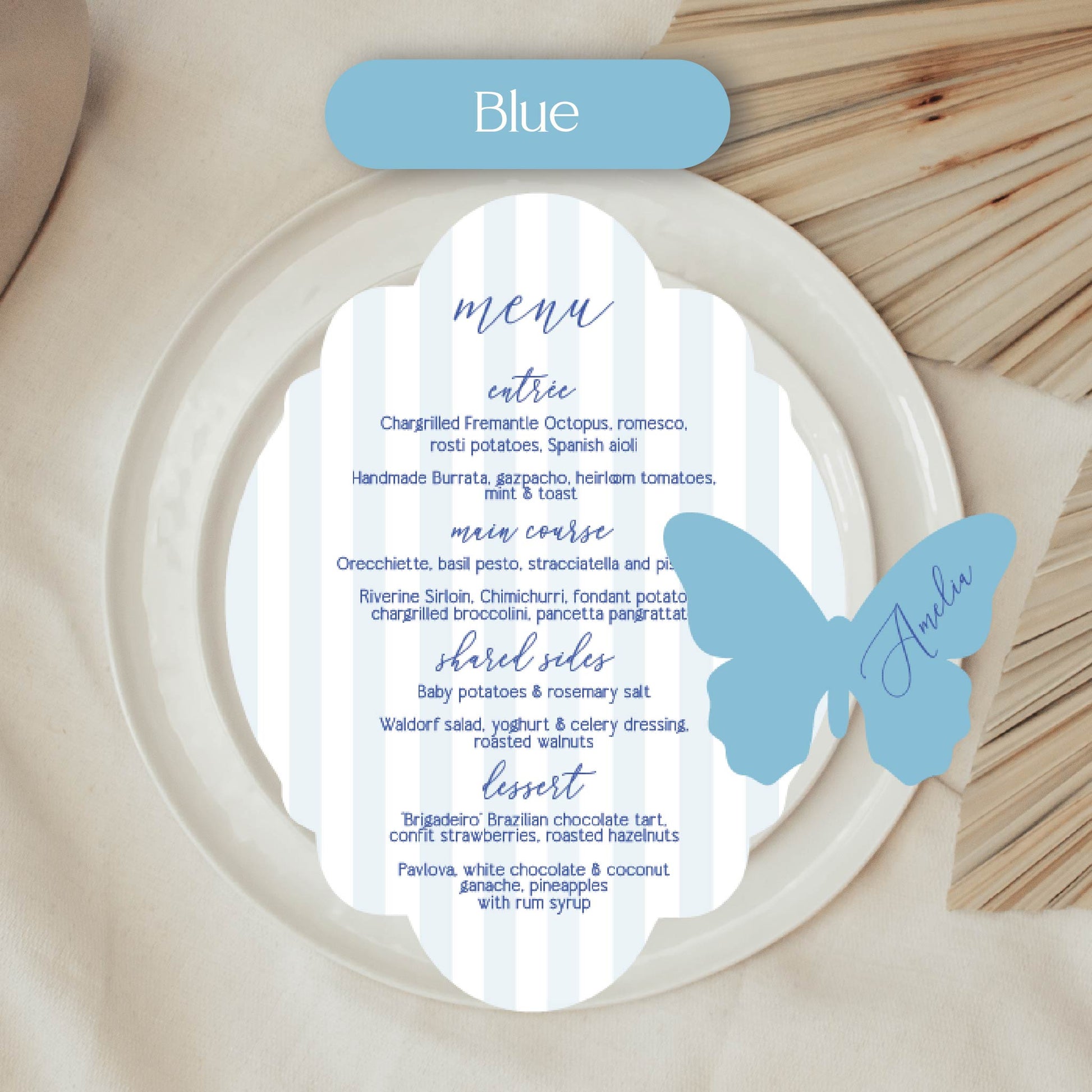 Butterfly-shaped menu card with blue accents on a wooden surface