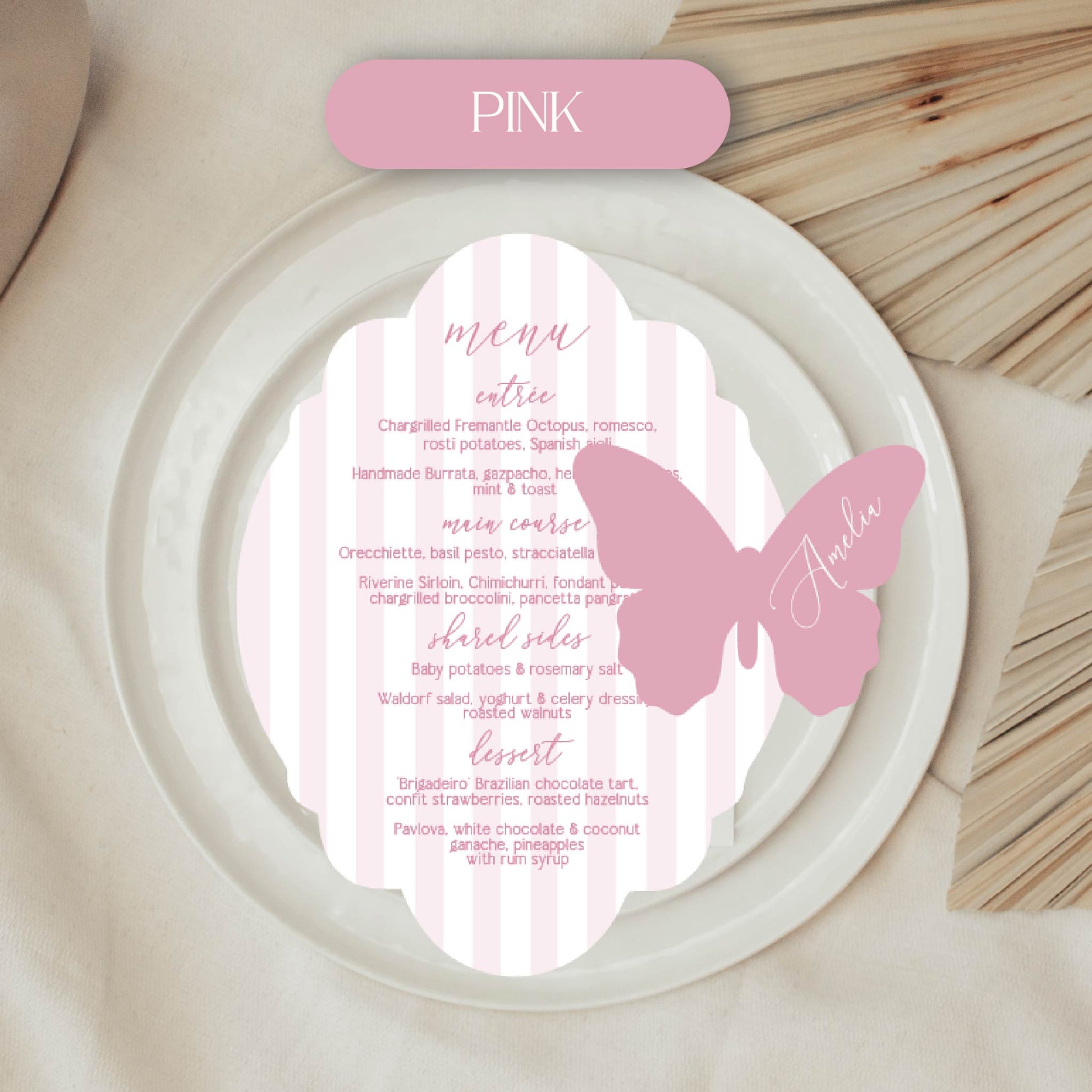 Butterfly-themed menu card with pink accents on a white plate.