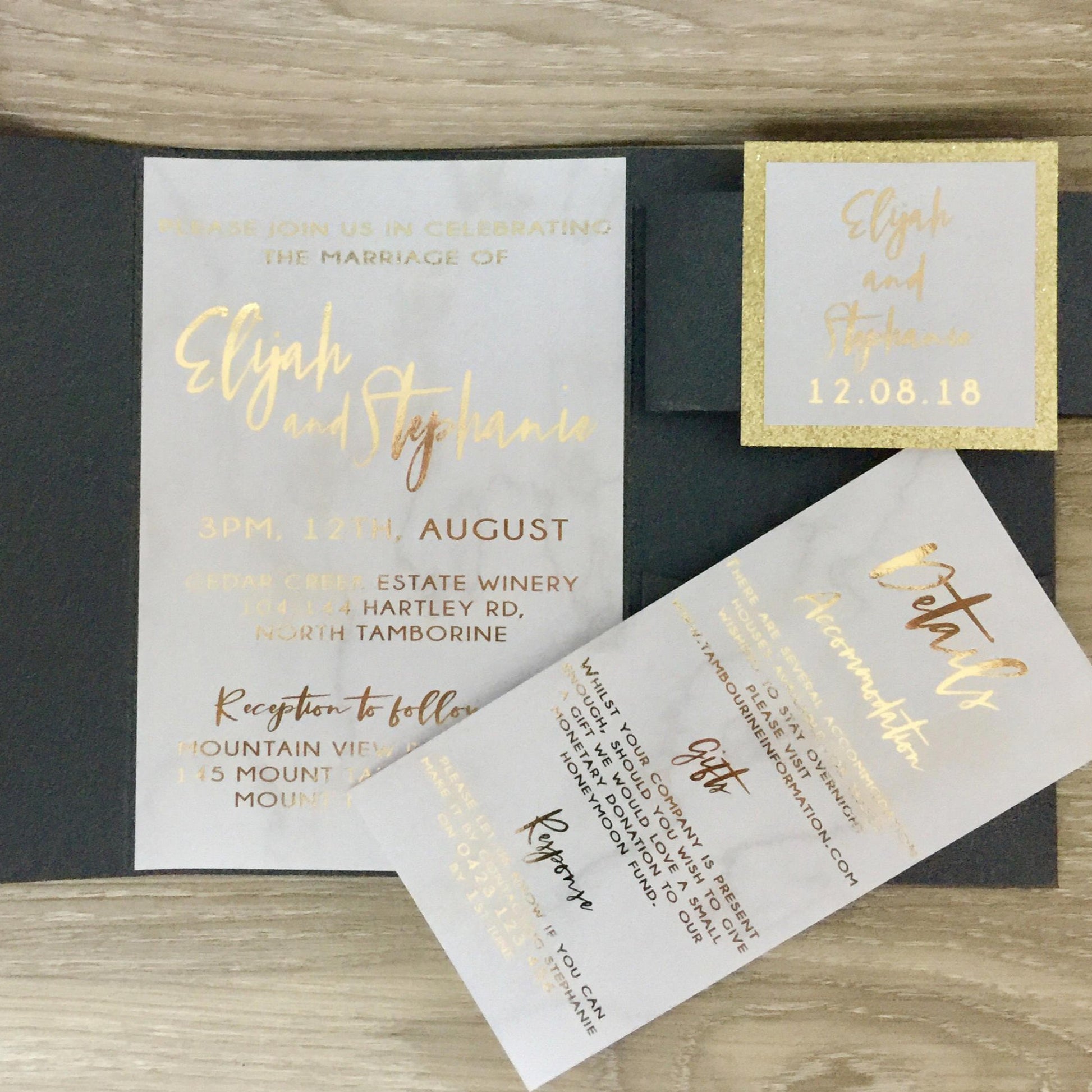 Black pocket fold wedding invitation with gold foil and marble detail